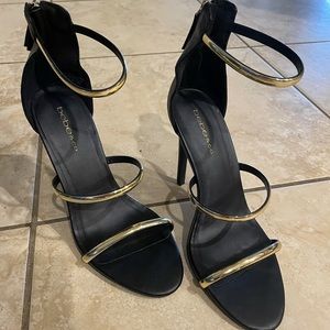 Bebe gold and black heels